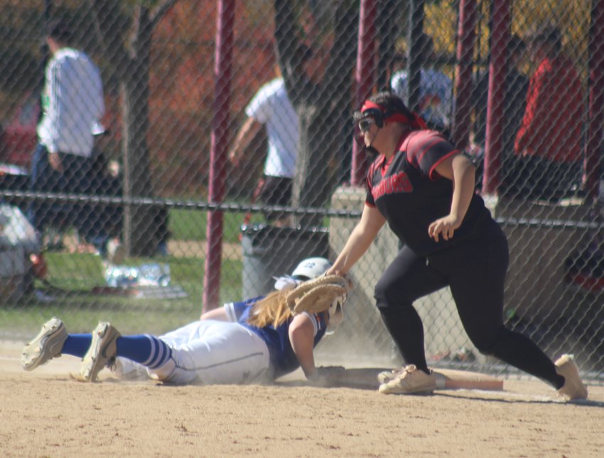 Strasburg's Madison Brewer puts a late tag on Fort Lupton's Reagan Mewbourne during the first round of the state 3A softball tournament at Aurora Sports Park Oct. 21.